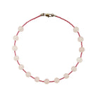 Aethera Dray Rose Quartz Collar Necklace featuring a polished rose quartz pendant on a delicate chain.