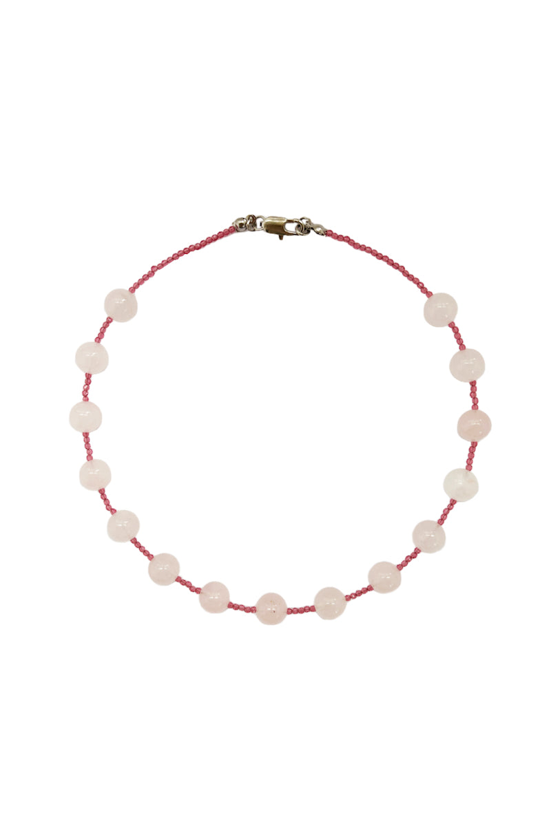 Aethera Dray Rose Quartz Collar Necklace featuring a polished rose quartz pendant on a delicate chain.