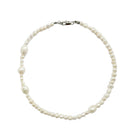 Aethera Cruisie Pearl Necklace featuring elegant white pearls on a delicate chain, perfect for sophisticated jewelry styling.