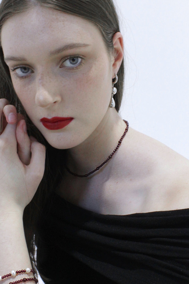 Aethera Baiana Ganet collar necklace featuring intricate gold-toned design with detailed craftsmanship.