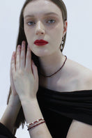 Aethera Baiana Ganet collar necklace with intricate gold-toned design, displayed on a neutral background.