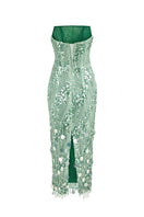 Green sequin strapless gown by HACCHIC COUTURE, featuring a fitted bodice and flowing skirt, perfect for formal occasions.