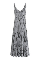 Maccapani Nice But Naughty black and silver maxi dress with elegant design and flowing fabric, perfect for stylish occasions.