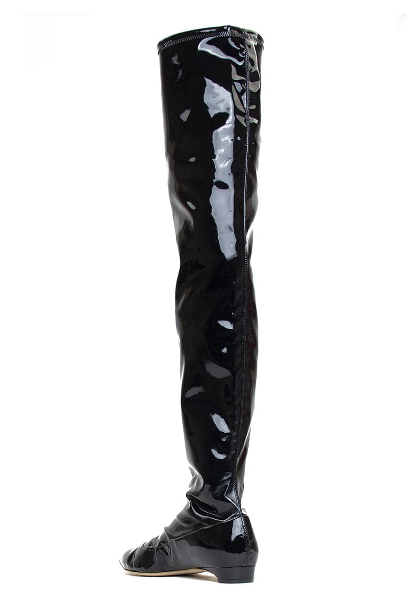 A pair of black patent-effect AERA Nicoletta boots with a sleek, shiny finish and ankle-high design shown from the back.
