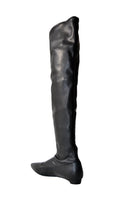 A pair of black Nappa-effect boots from AERA, featuring sleek design and sturdy sole, displayed from the back.