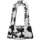 SAC DE SOUL Nina white and black top handle bag with sleek design and structured shape, front view showing elegant style.