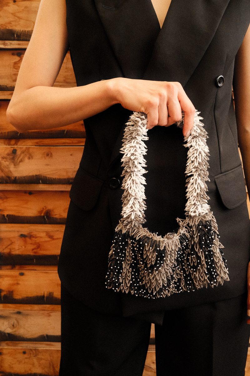 Black and white Nina Gray top handle bag by SAC DE SOUL featuring a stylish design and structured silhouette.