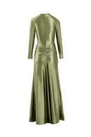 Light green Nocturne gown by Yassmin Saleh featuring a ghost back design and elegant flowing fabric.