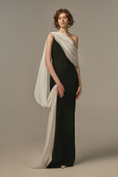Poem Nocturne gown in white and black, elegant nightwear with a flowing design, modeled on a person.
