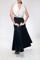 Navy blue Noelle maxi skirt by ANA + MARIA, flowing fabric with a stylish, elegant silhouette, displayed on a white background.