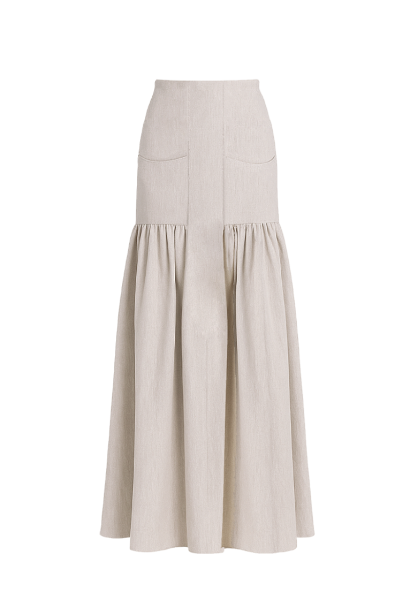 Ana + Maria Noelle maxi skirt in sand, flowing fabric with a relaxed fit, displayed on a model against a neutral background.