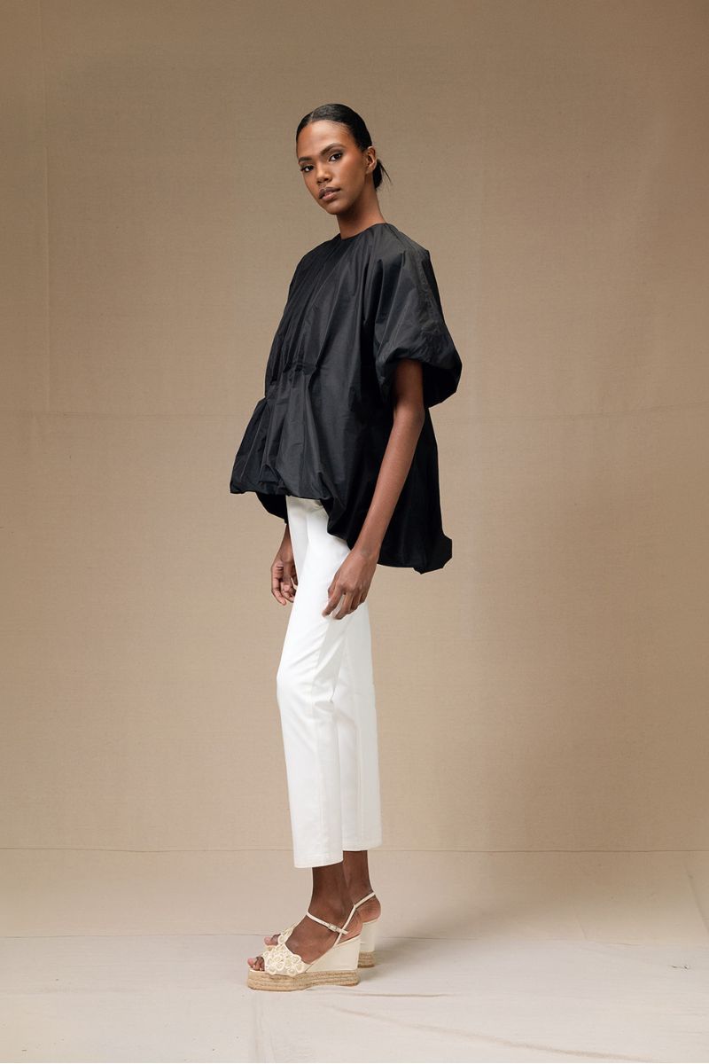 Black Nonora blouse by ANA + MARIA, shown as a stylish women's tops piece with a relaxed fit and elegant design.