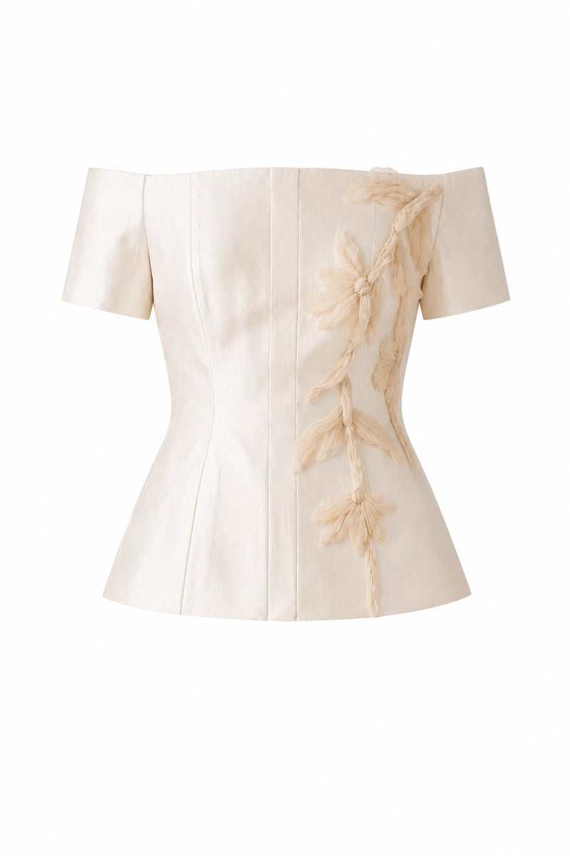Nihan Peker Nora top in vanilla color, a stylish sleeveless blouse with a relaxed fit and elegant neckline.