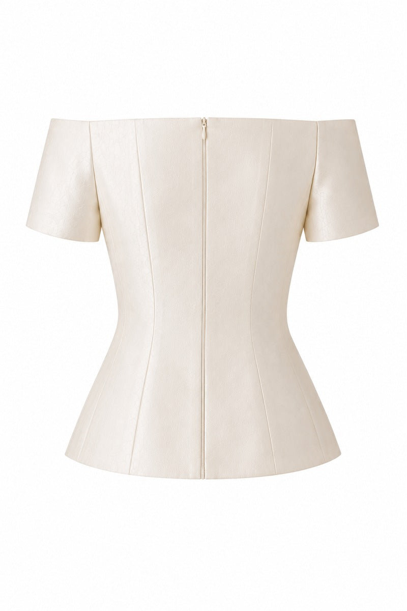 Nihan Peker Nora Top in vanilla color, a stylish sleeveless blouse with a relaxed fit and round neckline.