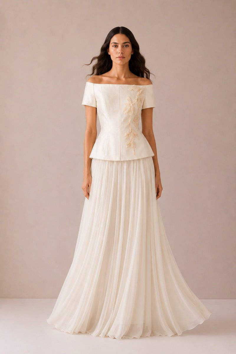 Nihan Peker Nora Vanilla top displayed on a hanger, showcasing its soft fabric and classic sleeveless design.
