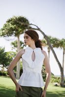 Elegant ivory Nova blouse by ANA + MARIA, shown as a stylish top with a flowy fabric and subtle design details.