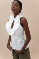 Ivory Nova blouse by Ana + Maria, stylish women's top with a flowy fit and elegant neckline, displayed on a hanger.