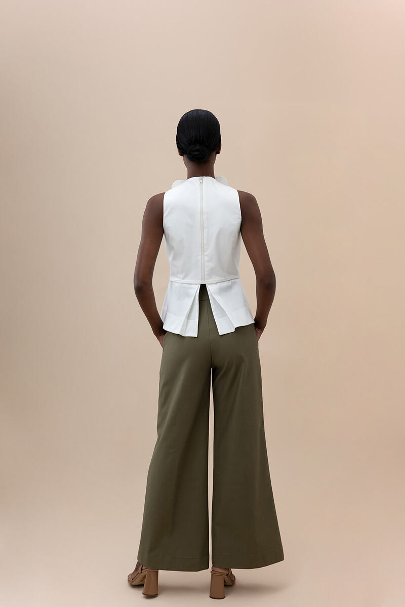 Elegant ivory Nova blouse by ANA + MARIA, showcasing a stylish tops design with a soft fabric and classic neckline.