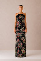 Elegant black gown by Nihan Peker, featuring flowing fabric and sophisticated design, ideal for formal occasions.