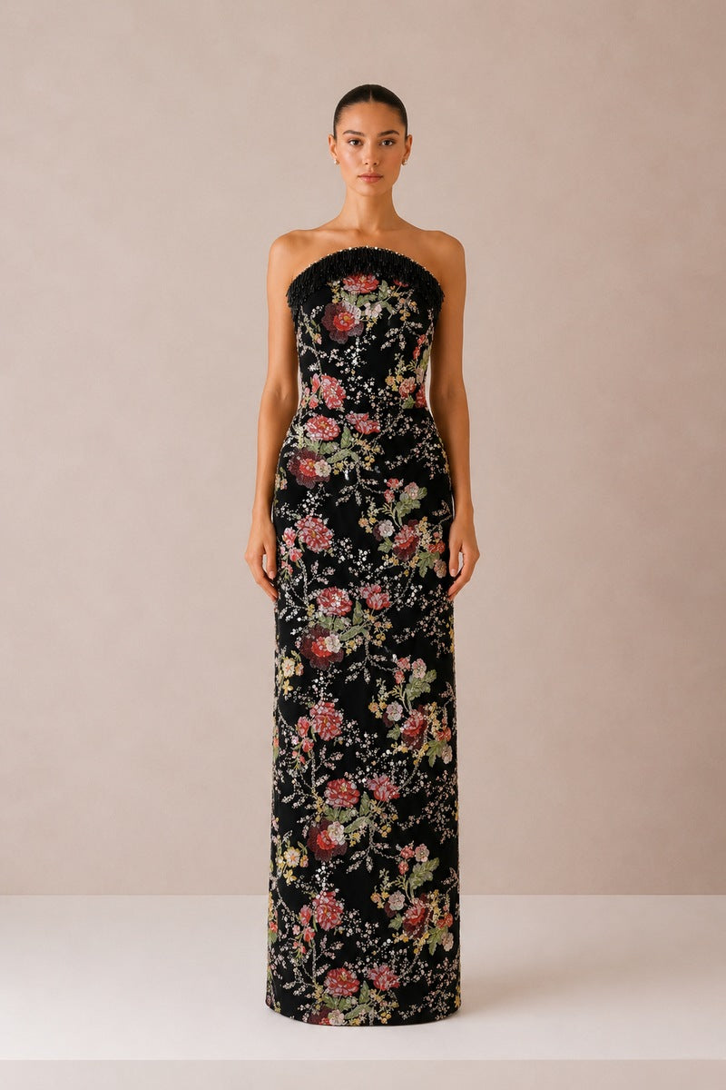 Elegant black gown by Nihan Peker, featuring flowing fabric and sophisticated design, ideal for formal occasions.