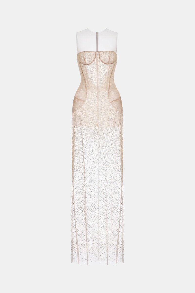 Nude embellished maxi dress by Montsand featuring intricate beadwork and flowing fabric, perfect for elegant occasions.