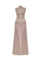 Nude sleeveless jacquard gown by Montsand featuring a flowing maxi dress with intricate woven patterns and elegant design.