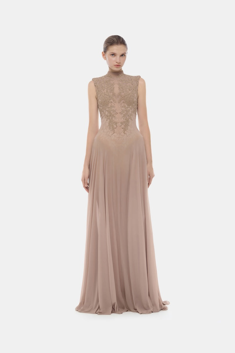 Nude sleeveless jacquard maxi dress by Montsand featuring a flowy silhouette and intricate textured fabric.
