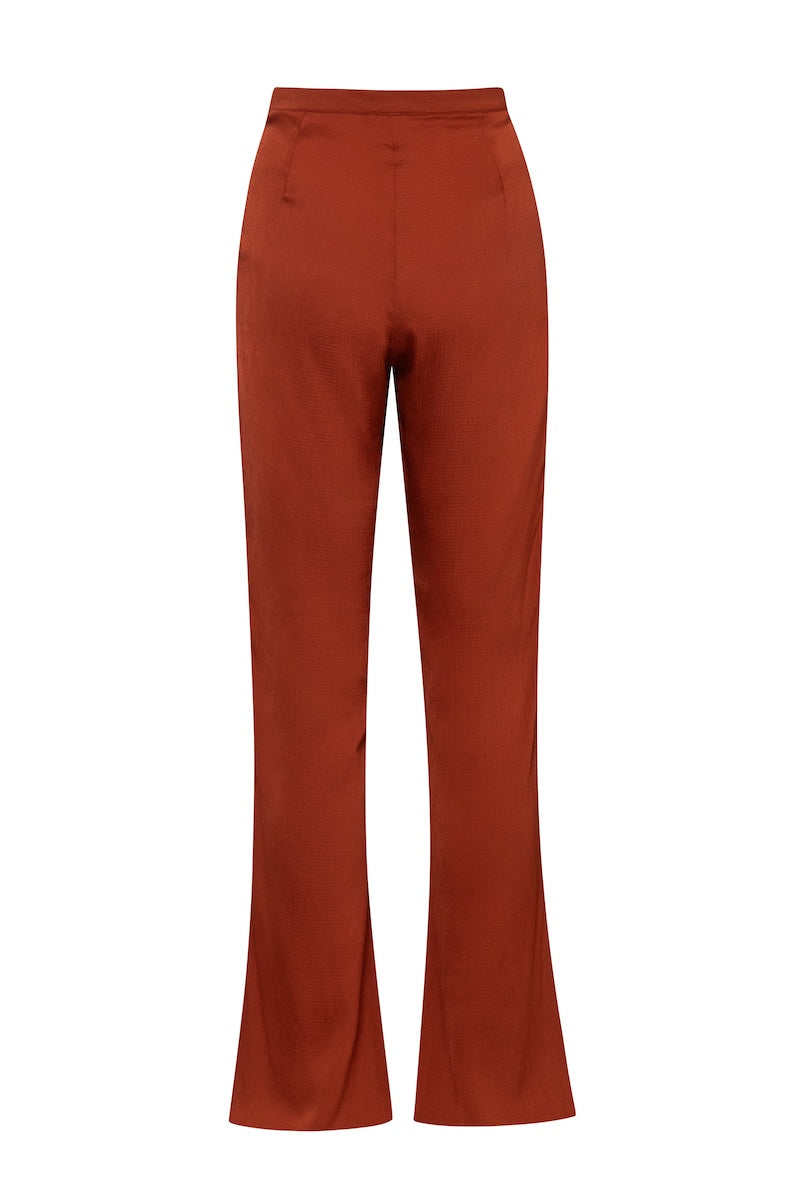 Baobab Numa pants in terracotta color, featuring a relaxed fit and stylish design, shown in this image.