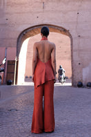 Baobab Numa Top in terracotta, stylish sleeveless blouse with a relaxed fit, showcasing warm earthy tone fabric.