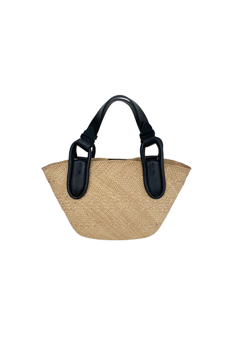 Black Nuqui basket top handle bag by ISIDORA MALVA featuring a woven design and sturdy black handle.