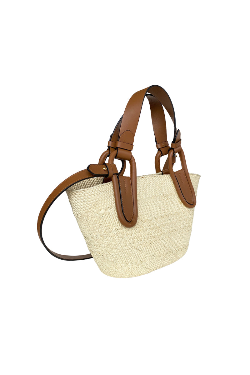 ISIDORA MALVA Nuqui basket in tan with top handle, woven design, and spacious interior, perfect for casual or outdoor use.