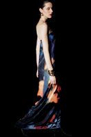 Sisters Nyra maxi dress in Amber Sky with flowing fabric and vibrant color, perfect for casual or semi-formal occasions.