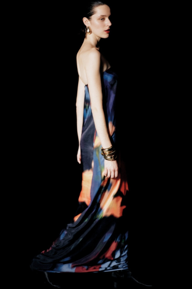 Sisters Nyra maxi dress in Amber Sky with flowing fabric and vibrant color, perfect for casual or semi-formal occasions.