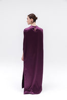 Studio NK Obscura cape in aubergine, stylish women's top with a flowing design and rich purple color, shown on a model.