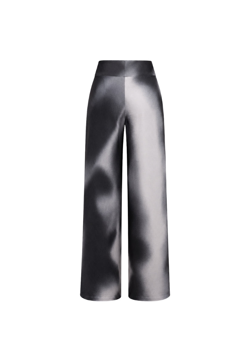Black print OLIVO pants by Tinta Latina showing the stylish, fitted design with a bold pattern on the fabric.