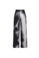 Black print OLIVO pants by Tinta Latina showing the stylish, fitted design with a bold pattern on the fabric.