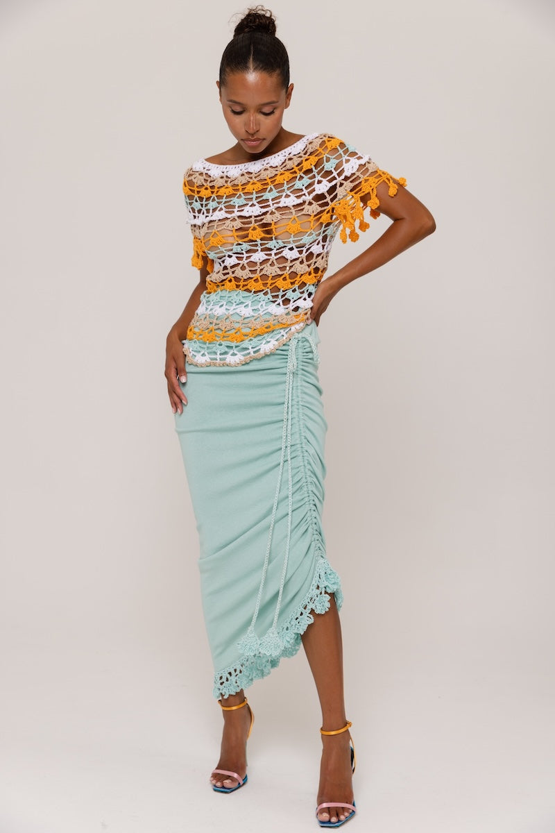 Handmade crochet top in orange and blue by Andreeva, featuring intricate patterns and a stylish, bohemian design.