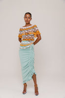 Mint Carnation knit midi skirt by Andreeva with handmade embroidery, featuring a fitted waist and flowing silhouette.