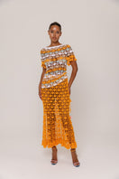 Handmade crochet top by Andreeva in vibrant orange and blue with intricate crochet patterns, perfect for stylish summer wear.