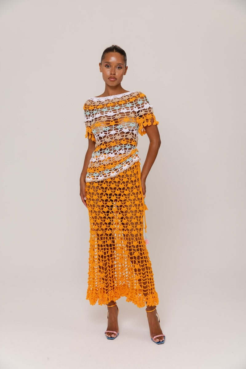 Handmade crochet top by Andreeva in vibrant orange and blue with intricate crochet patterns, perfect for stylish summer wear.