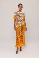 Handmade crochet top by Andreeva featuring vibrant orange and blue Bird of Paradise floral design.