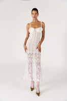 White handmade crochet chrysanthemum maxi dress by Andreeva, featuring intricate crochet details and flowing fabric.