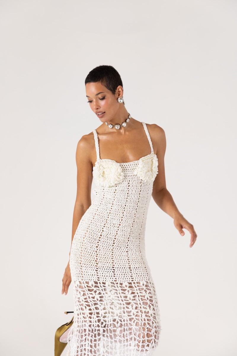 White handmade crochet chrysanthemum maxi dress by Andreeva, featuring intricate crochet details and flowing fabric.