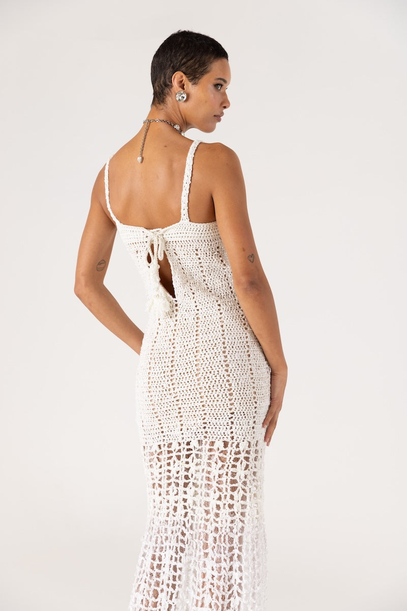 White handmade crochet chrysanthemum maxi dress by Andreeva, featuring intricate crochet details and flowing fabric.
