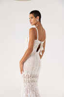 White handmade crochet chrysanthemum maxi dress by Andreeva, featuring intricate crochet details and flowing fabric.