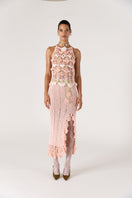 Pink handmade crochet chrysanthemum midi skirt by Andreeva, featuring intricate floral patterns and a soft, flowing silhouette.