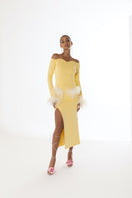 Yellow vanilla knit midi skirt with feather details from Andreeva, featuring a soft, textured fabric and stylish design.