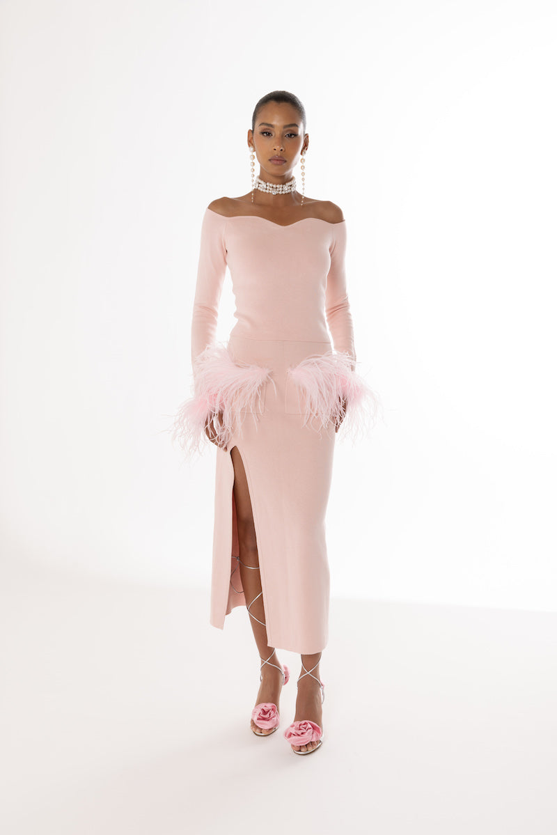 Pink vanilla knit midi skirt with feather details by Andreeva, featuring a soft, textured fabric and elegant design.