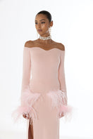 Pink vanilla knit midi skirt with feather accents from Andreeva, showing soft fabric and feather details.
