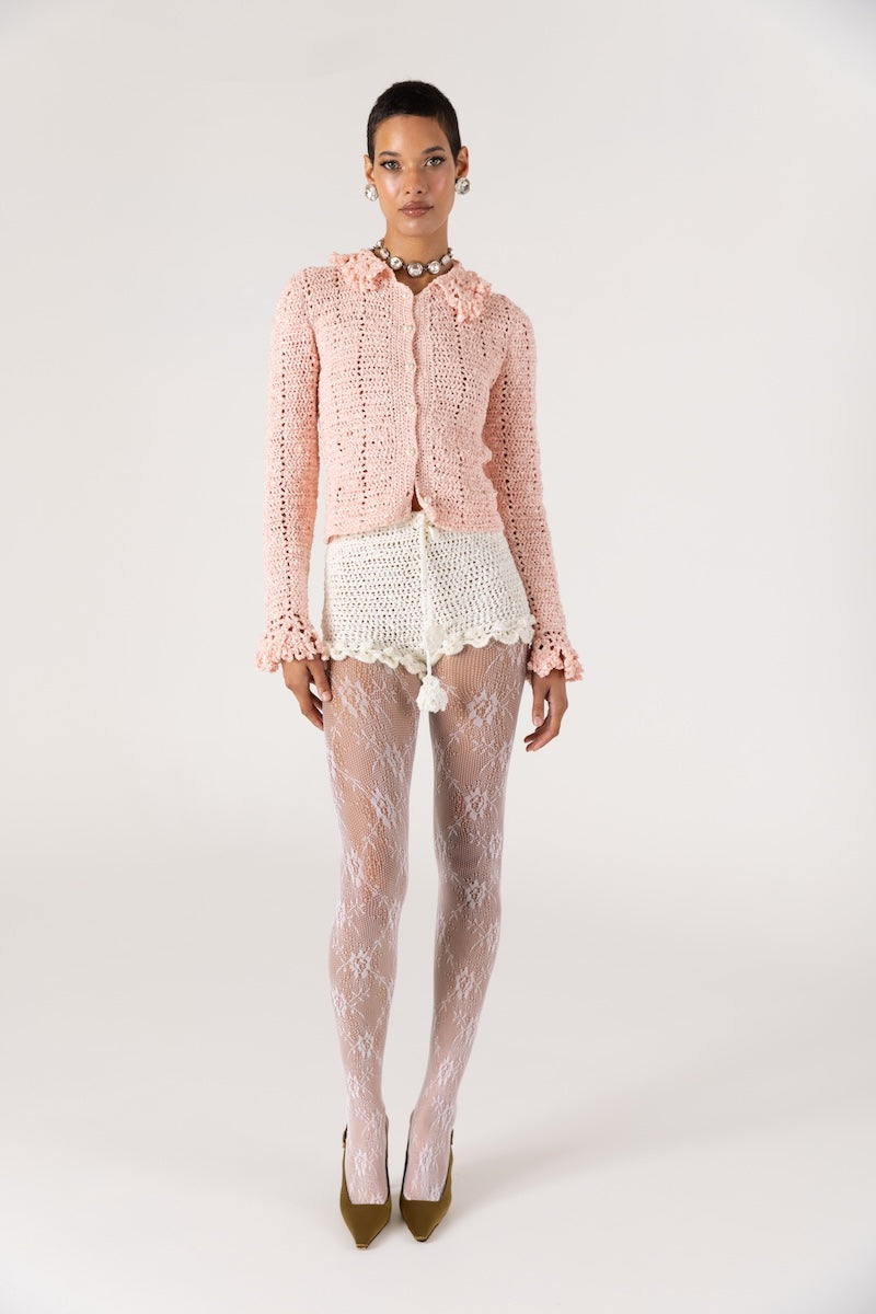 White handmade crochet shorts by Andreeva featuring intricate floral patterns and a relaxed fit, perfect for casual wear.